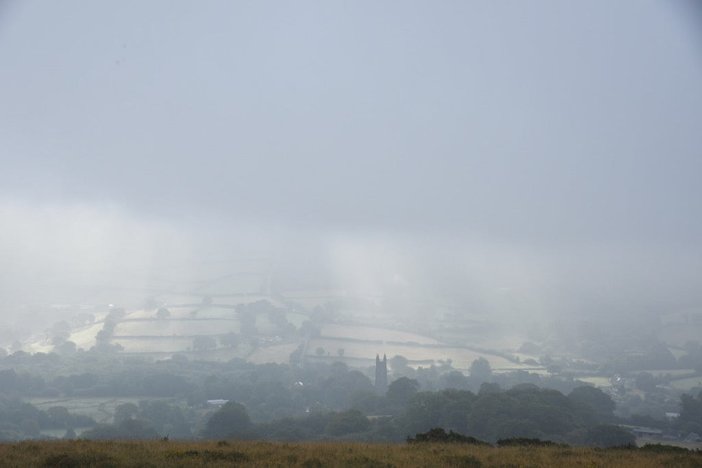 Atmospheric autumn mist over widecombe-in-the-Moor on Dartmoor