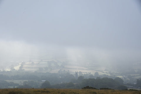 Atmospheric autumn mist over widecombe-in-the-Moor on Dartmoor